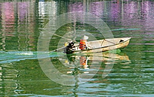 Asian sanitation worker, polluted water