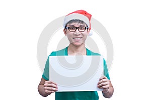 Asian Santa Claus man with eyeglasses and green shirt has holding a white blank advertisement banner isolated on white background
