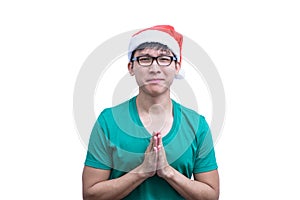 Asian Santa Claus man with eyeglasses and green shirt has plead