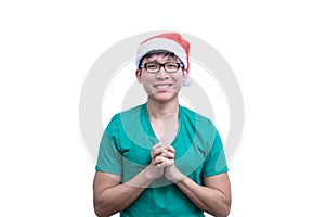 Asian Santa Claus man with eyeglasses and green shirt has plead