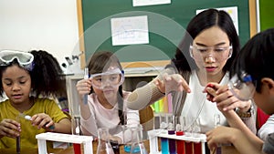 Asian school teacher and students in science class