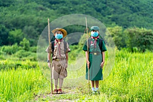 Asian Scout  wearing a mask and Stand straight, new normal
