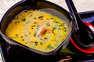 Asian seafood soup with spics and herbs