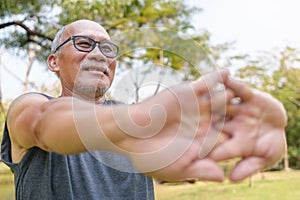 Asian Senior Chinese man stretching hands