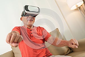 Asian Senior chinese man is using VR glasses