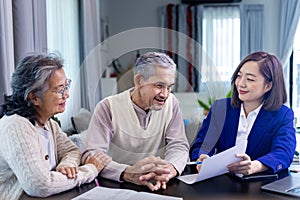 Asian senior couple get advice from lawyer on legal financial contract and insurance health care benefit for retirement home visit