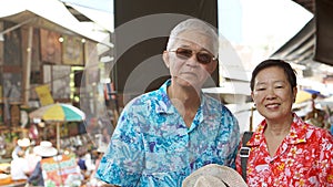 Asian senior couple having fun retirment trip around the world