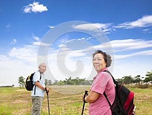 Asian senior couple hiking in nature