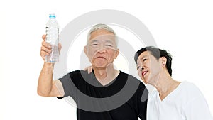 Asian Senior couple holding water bottle stay hydrate for health