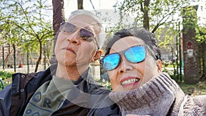 Asian senior couple sefie happy retirment trip to Europe