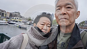 Asian senior couple selfie happy retirment trip to Europe