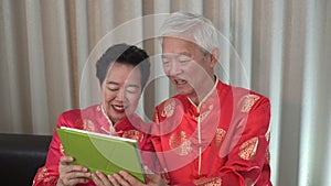 Asian senior elder call to family Chinese New Year celebration