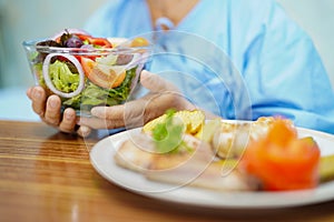 Asian senior or elderly old lady woman patient eating breakfast healthy food