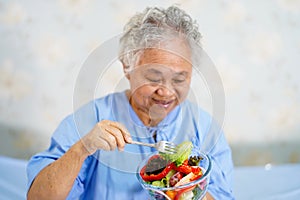 Asian senior or elderly old lady woman patient eating breakfast healthy food