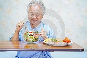 Asian senior or elderly old lady woman patient eating breakfast healthy food