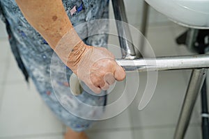 Asian senior or elderly old lady woman patient use toilet bathroom handle security in nursing hospital