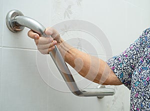 Asian senior or elderly old lady woman patient use toilet bathroom handle security in nursing hospital ward  healthy strong