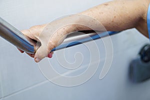 Asian senior or elderly old lady woman patient use toilet handle security in nursing hospital ward : healthy strong medical