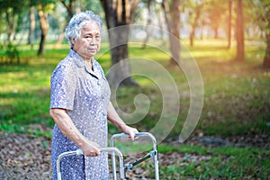 Asian senior or elderly old lady woman patient walk with walker in park