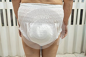 Asian senior or elderly old lady woman patient wearing incontinence diaper in nursing hospital ward, healthy strong medical