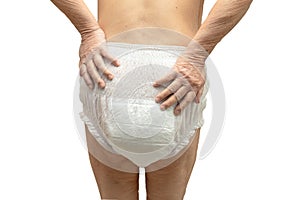 Asian senior or elderly old lady woman patient wearing incontinence diaper in nursing hospital ward on white background