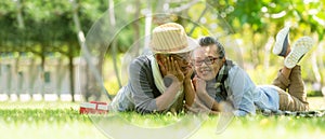 Asian senior elderly retire couple relaxation in the nature park happy and relax time.