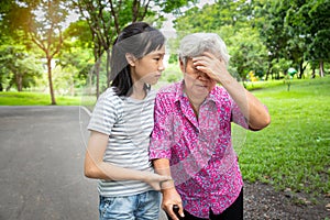 Asian senior grandmother has headache,touching her head with her hands,vertigo;dizziness;sick elderly moman having heat stroke,