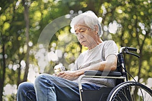 Asian senior man sitting in wheelchair