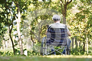 Asian senior man sitting in wheelchair