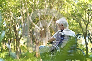 Asian senior man sitting in wheelchair