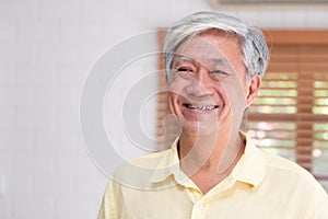 Asian senior man smile in living room at home,Happy aging at home concept