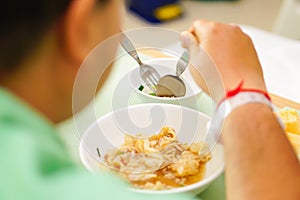 Asian senior old lady woman patient eating breakfast healthy food in hospital.