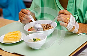 Asian senior old lady woman patient eating breakfast healthy food in hospital.
