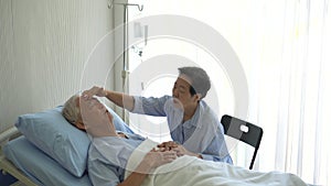 Asian senior old man sick at hospital wife visit taking care couple love marriage life