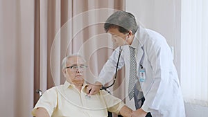 Asian senior patient having medical exam with doctor in hospital
