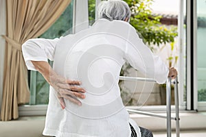 Asian senior patient with lower back pain or back muscle injury,old elderly having backache,painful of spinal joint,inflammation