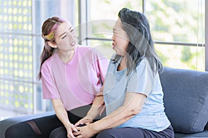 Asian senior pensioner retirement cheerful happy healthy fit mother in casual sportswear and young beautiful daughter sitting