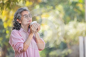 asian senior woman with coffee