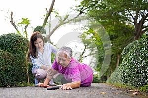 Asian senior woman fell down on lying floor because faint and limb weakness and Crying in pain form accident and her daughter came