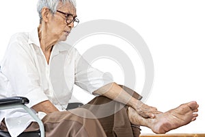 Asian senior woman massaging ankle and feet,old elderly had beriberi,cramp,numbness in her feet,sore toe joints,peripheral photo