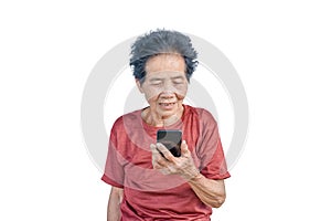 Asian senior woman smiles and video call isolated in white background. Strong elderly grandmother feeling happy using mobile cell