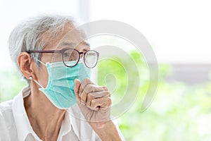 Asian senior woman suffer from cough with face mask protection,elderly woman wearing face mask because of air pollution,Sick old