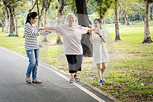 Asian senior woman walking in a straight line,follow white line on the floor and trying to balance,elderly people exercise with