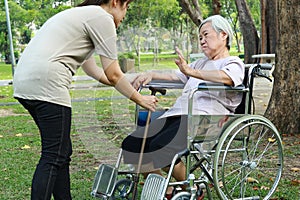 Asian senior woman who refuses to walk,female elderly afraid of getting up from wheelchair,old people fear of falling,geriatric