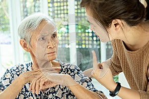 Asian senior woman is confused because she can not remember the face of their family or forget her daughter,memory loss in elderly photo