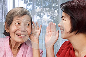 Asian seniors woman hearing loss , Hard of hearing