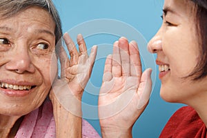 Asian seniors woman hearing loss , Hard of hearing try to talk with daughter