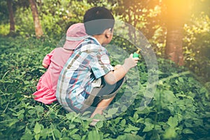 Asian sibling playing in the park. Children relaxing holiday. Vi