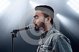 Asian singer singing with microphone photo