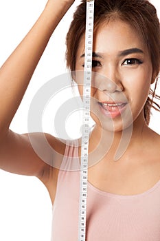 Asian skinny girl with measuring tape